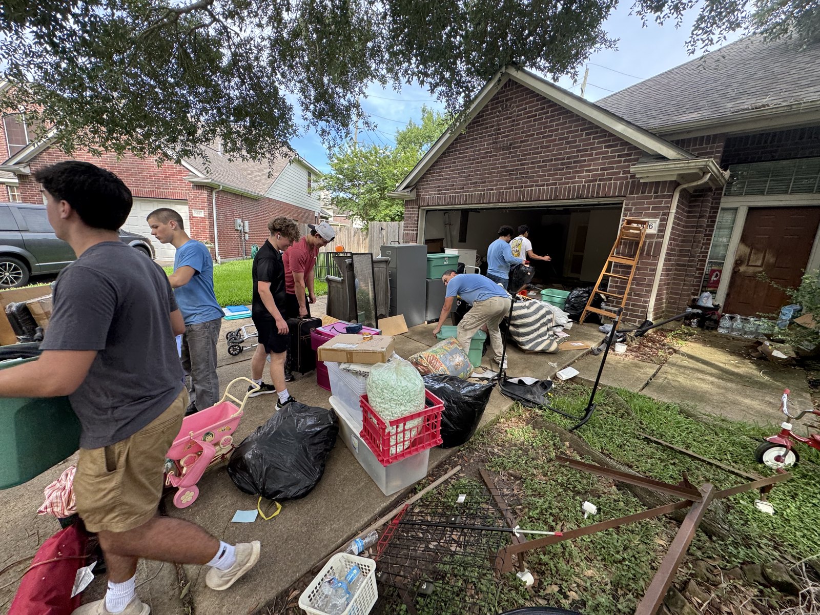YFNTeens crew helping a local family move and haul items — real teens doing real work